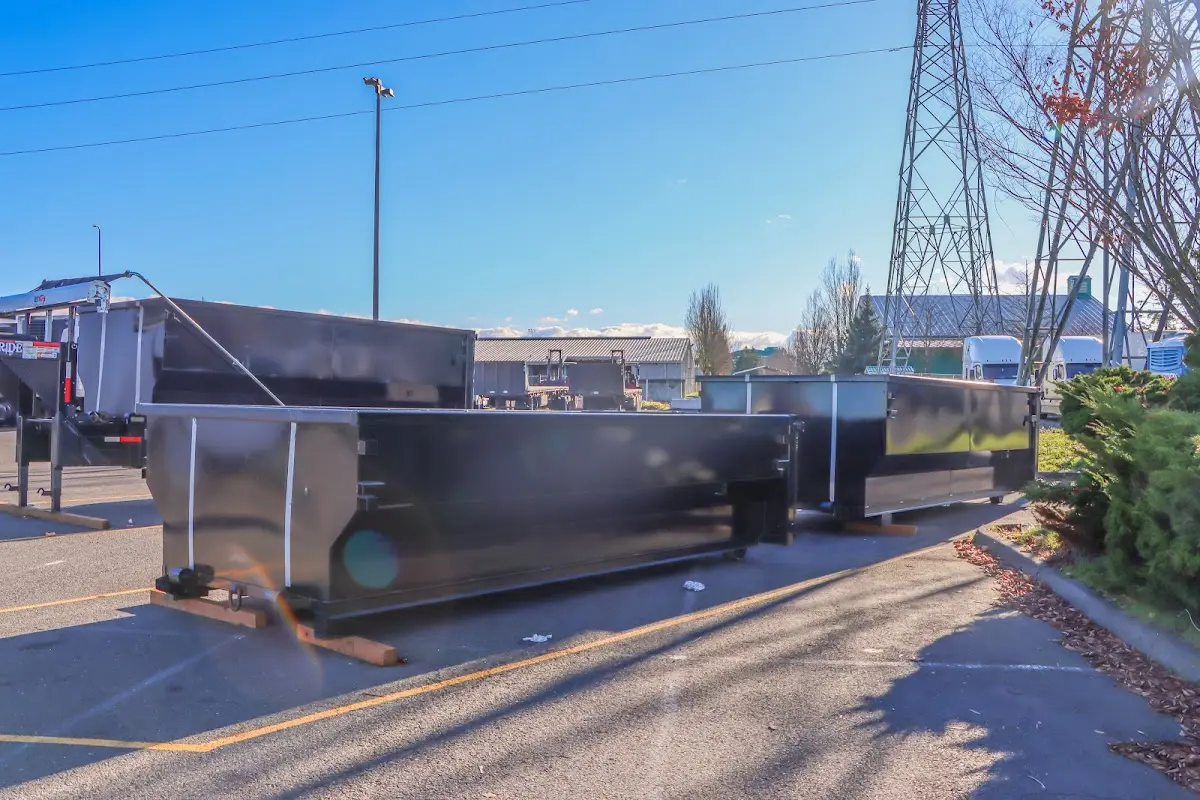 Roll-off dumpster ready for waste disposal at job site for 2 Yard Dumpster Rental in Oak Grove